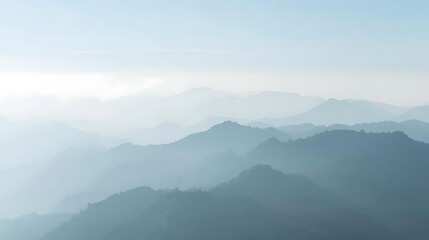 Naklejka premium Misty mountains under soft morning light