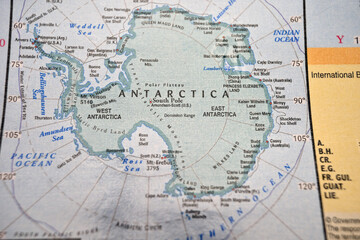 Obraz premium Antarctica Continent on Soft Blurred Polar World Map Background with Defocused Ice Sheet and Southern Ocean Location View