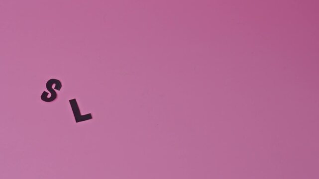 Stop Motion Of Words "Sleep Day" Appearing Letter By Letter With Yellow Star On Pink Background