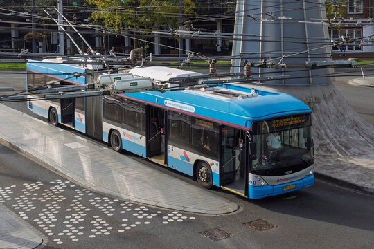 Arnhem, Netherlands, September 19, 2025. A blue articulated electric trolleybus operated by Breng at a junction with complex overhead catenary wiring.