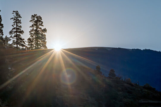 Radiant Sunrise Sunburst over Himalayan Mountain Ridges from Kanarkha Village, Kumaon, Uttarakhand, India