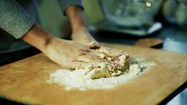Kneading Fresh Dough on Wooden Board with Flour. Preparing Homemade Bread or Pastry. Process of Dough Preparation