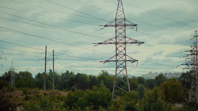 High Voltage Power Lines and Electricity Pylons. Energy Infrastructure and Electric Grid. Engineering Power Supply