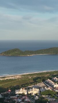 Morro do Lampiao, Campeche in Floprianopolis. Aerial view in vertical video