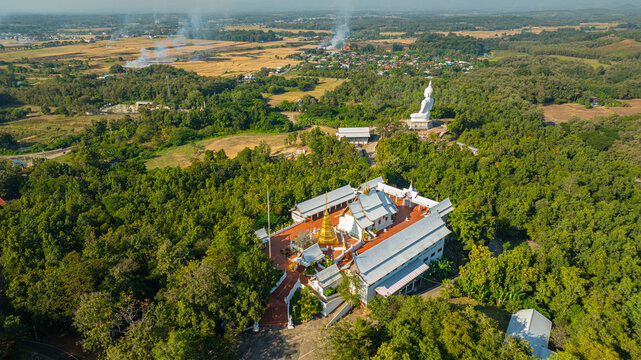 The historic stupa of Wat Phra That Pu Jae in Phrae Province is a centuries old sacred site situated on a mountain. The square chedi enshrines a revered relic of the  an important cultural