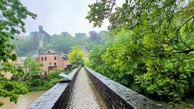 Rainy Day Walk Across Bock Bridge in Luxembourg City Facing Ancient Eich Gate