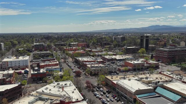 Slow Aerial Drone rise of main street Fort Collins Colorado near CSU.