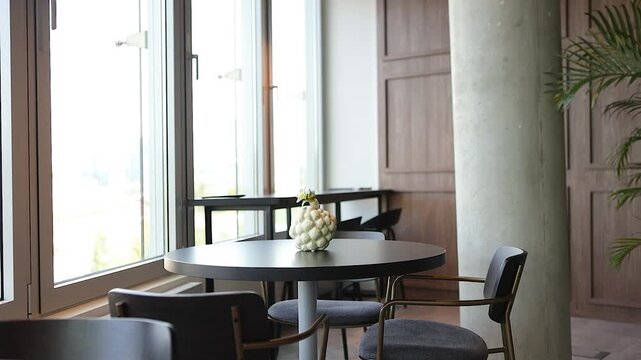 Empty tables and chairs in office kitchen cafeteria