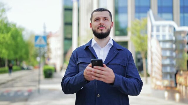 Young man engages with smartphone in urban environment. Exhibits focused and thoughtful expressions, gazing at surroundings. Conveys curiosity, connection, and a moment of reflection in daily life.