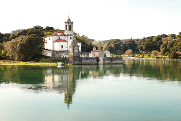 Obraz premium The Cemetery of Niembro and Our Lady of Sorrows church in Barro, Asturias