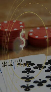 Vertical video: Camera shifting, fanned clubs revealing royal flush, $ pulsing and BANK showing bet