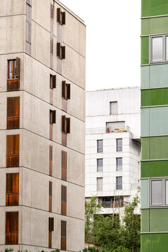 Vertical facade planes in La Confluence place Lyon apartments beside green residential housing, with balconies and urban architecture in France
