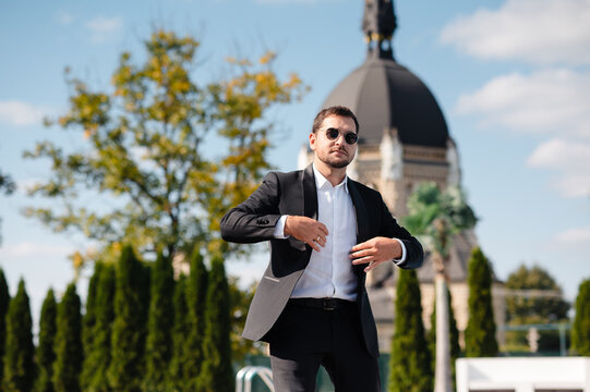 Man in Tuxedo Adjusting Jacket