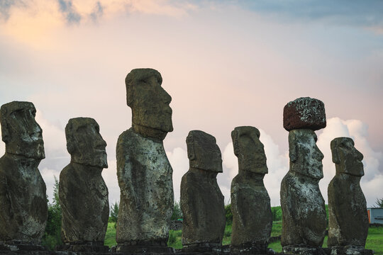 Ancient Moai statues in a row on Easter Island at sunset