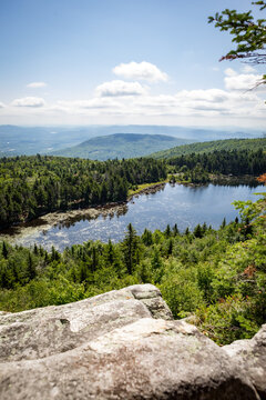Sunny mountain overlook of Lake Solitude from Mount Sunapee