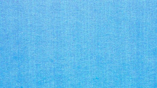 blue cardboard paper texture background stop motion