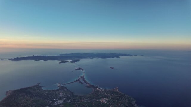 Left side aerial cockpit view of Ibiza island (IBZ) taken from over Formentera islet, captured at dusk. 3000m high.