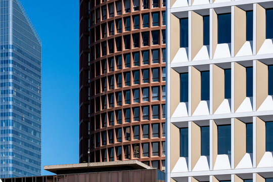 Glass towers in Lyon layer office architecture with a grid facade of windows, letting urban density tighten the contemporary composition