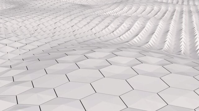 Seamless loop of abstract white geometric hexagons morphing and undulating in a wave pattern. Clean 3D animated background.