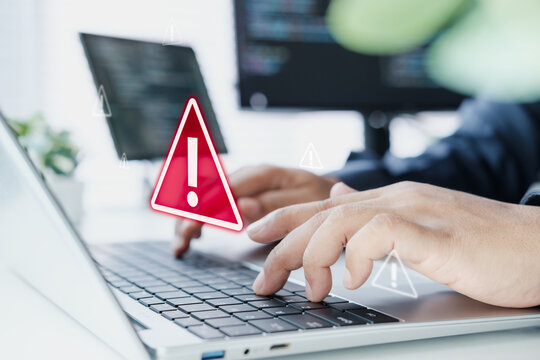 AI system monitoring alert on laptop dashboard with warning signal, anomaly detection in modern workspace, developer observing system health metrics, real time performance issues in SaaS environment