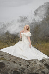  Elegant bride posing outdoors, wearing a white wedding dress and veil, showing off her wedding attire © Ольга Калинчук