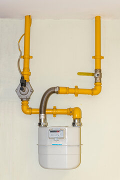A gas meter mounted on the wall. This is gas supply equipment.