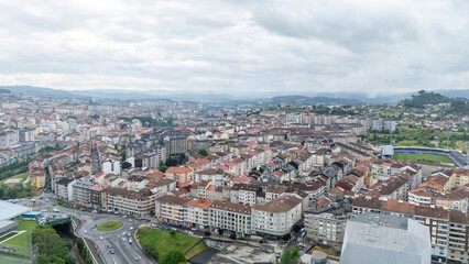 Fototapeta premium Ourense cityscape from above with urban development