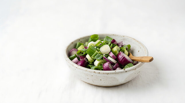 Fresh Chopped Onions and Spring Onions in a bowl and tablespoon for Healthy Cooking Preparation
