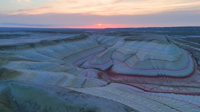 multicolored canyon at sunset Kyzylkup is a natural landmark in the Mangystau region of Kazakhstan. It is a group of colorful hills with multicolored layered slopes that resemble the Italian dessert t
