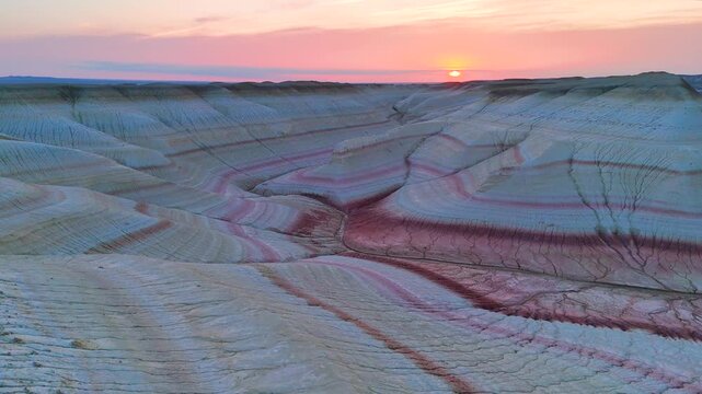 multicolored canyon at sunset Kyzylkup is a natural landmark in the Mangystau region of Kazakhstan. It is a group of colorful hills with multicolored layered slopes that resemble the Italian dessert t