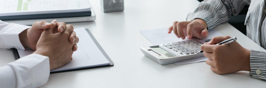 Accountant group meets to collaborate and finalize project figures