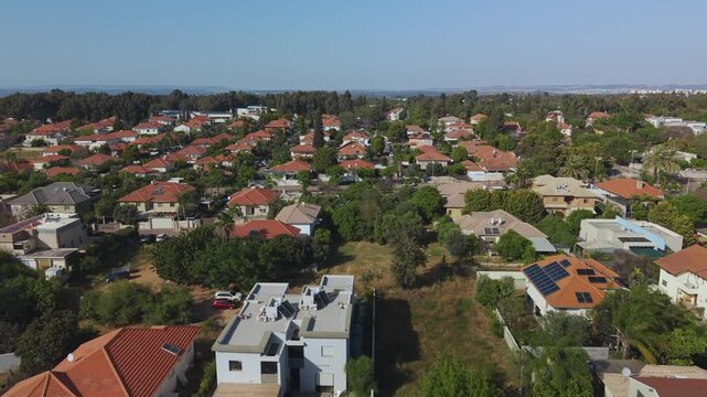 Pardes Hanna features narrow intimate streets decorated with mature fruit trees and dense vegetation giving a quiet village feel in the city.