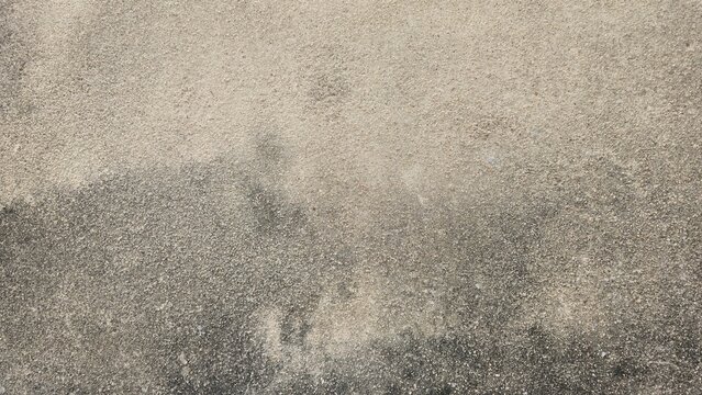Black mold and moss on old concrete wall texture. Weathered concrete surface stained with black mold. Dark grunge concrete texture gradient background.