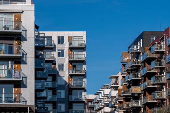 Facade angles and balcony rows meet across residential apartment building blocks in Loren, showing urban architecture under Oslo, Norway sky