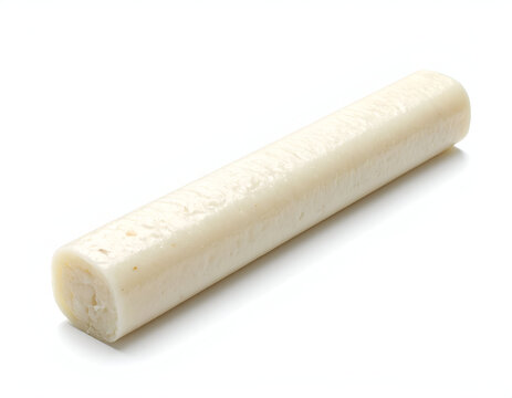 Pristine minimal food photography capturing a single long cylindrical white string cheese or rice cake.