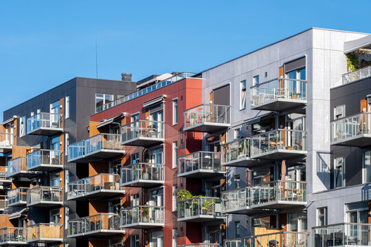 Colorful facade rhythm defines a residential apartment building in Loren with balcony lines across urban architecture in Oslo, Norway
