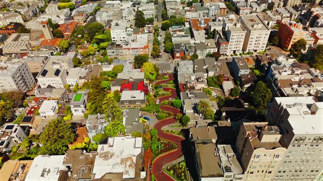 Drone view above Lombard Street gardens and dense residential neighborhood