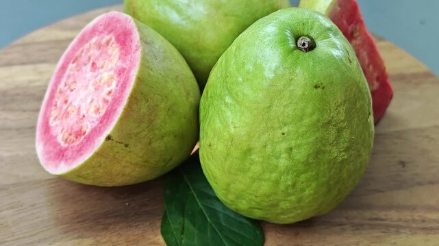 Pink guava on wooden board. 