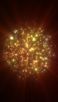 Abstract glowing cluster of golden particles and light sparks on a dark background, resembling cosmic energy or a festive burst.