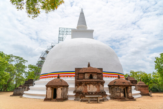 Kiri Vehera white stupa with brick altars, partially in scaffolds, Pollonaruwa, Sri Lanka