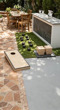 Outdoor game setup with cornhole and bocce near patio
