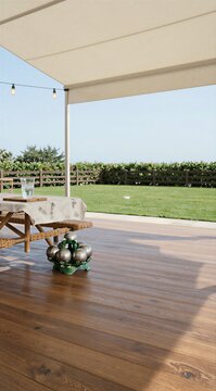 Patio deck with table and retractable awning over lawn