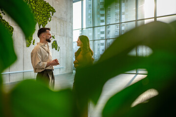 Business people networking with world map background in eco office © Migma_Agency