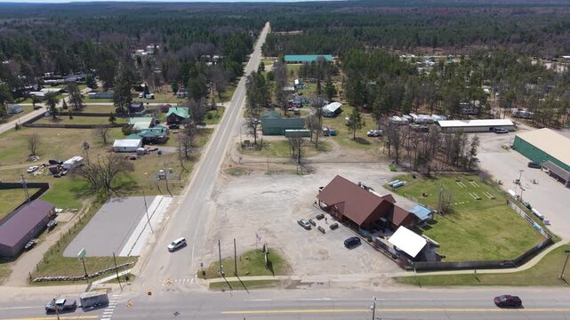 Drone flying east over center of Luzerne Michigan, small touristy town between Grayling and Mio.