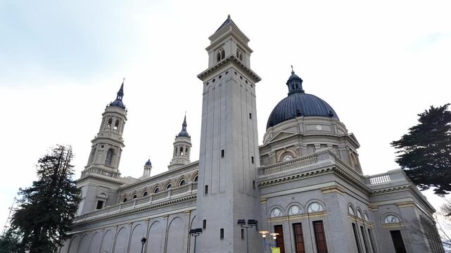 Low angle view revealing the impressive facade of the historic Saint Ignatius Church, located on the University of San Francisco campus, showcasing its detailed Spanish Baroque architecture