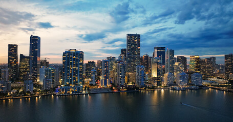 Fototapeta premium Miami cityscape reflecting urban skyline at dusk