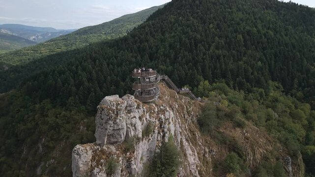 Drone orbit shot of tourists on the wooden spiral observation deck at Valla Canyon, Kastamonu, Turkey.