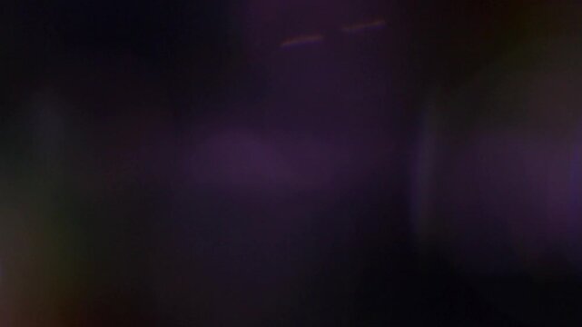 Light passes through glass, crystalline reflections from a prism. Different colors and hues.