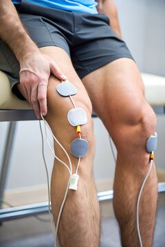Person's Leg with Electrodes on Knee for Medical Treatment or Rehabilitation 