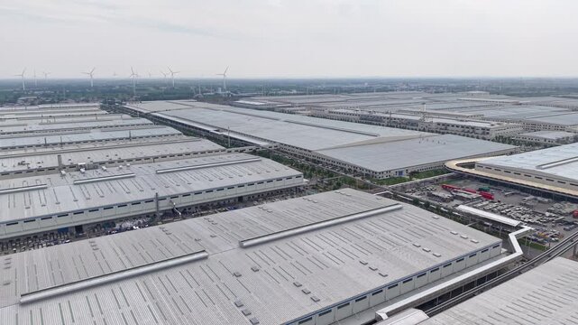 Aerial View of a Large Modern Industrial Factory Complex with Warehouses
